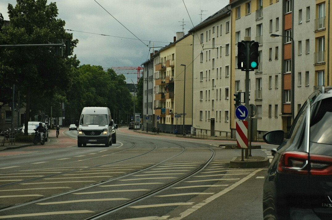 Live broadcast van with a mast on a city street