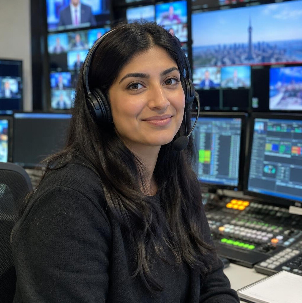 Woman wearing headset in a broadcast control room